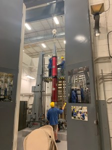 NASA engineers preparing for Spin Test of the rocket. Ensuring the balance of the rocket. Students are given access to testing room for observation